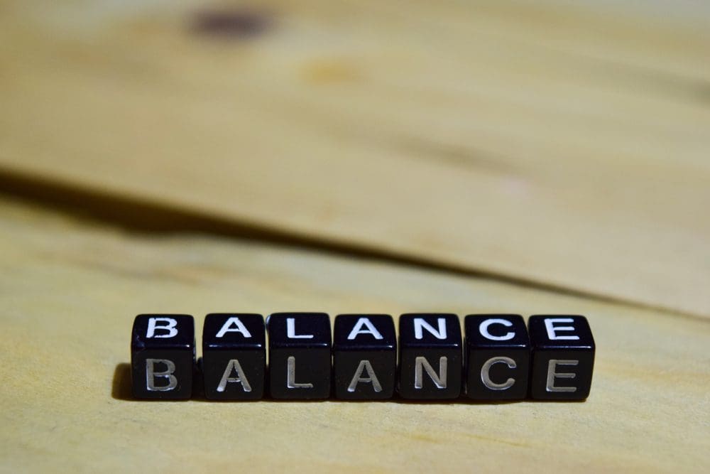Photo of black and white blocks spelling out the word Balance